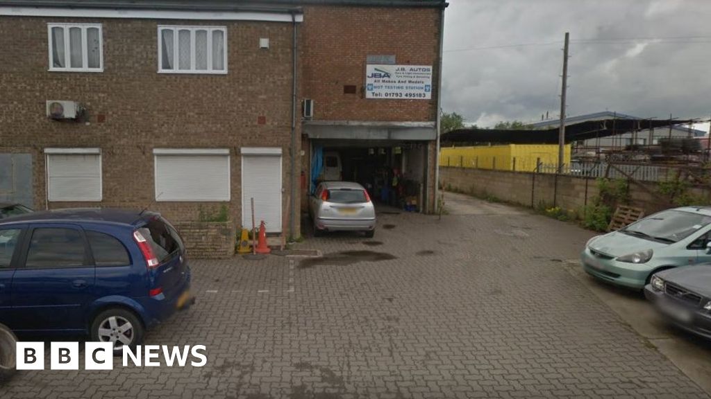 Man dies trapped under car at Swindon garage