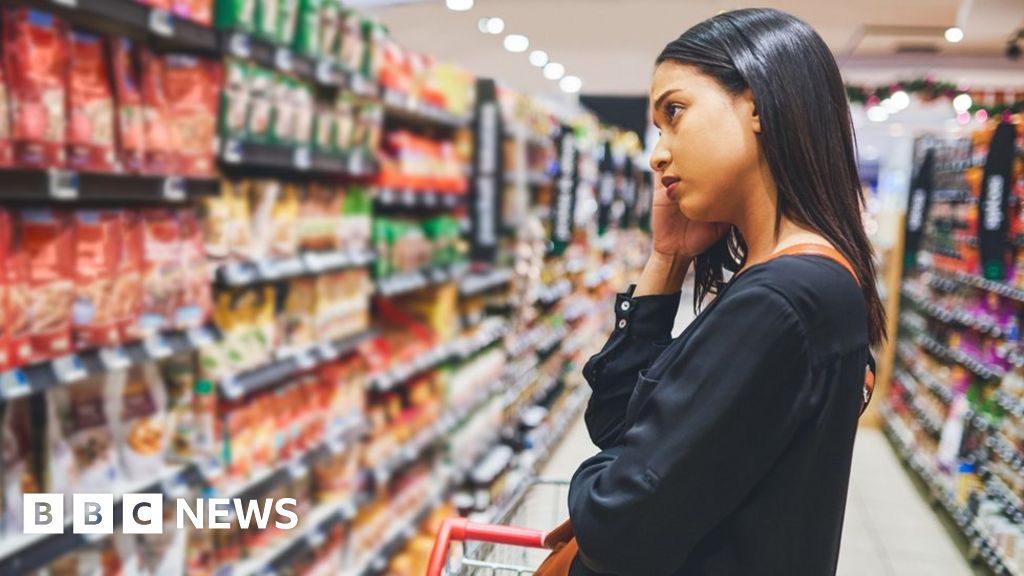 Woman looking sad in supermarket