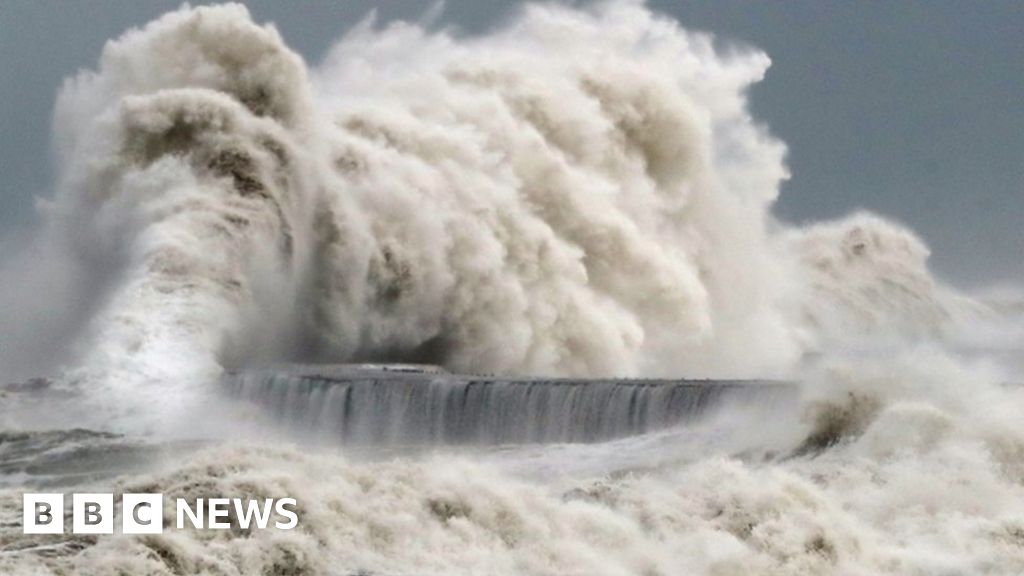 Waves crashing into a seafront