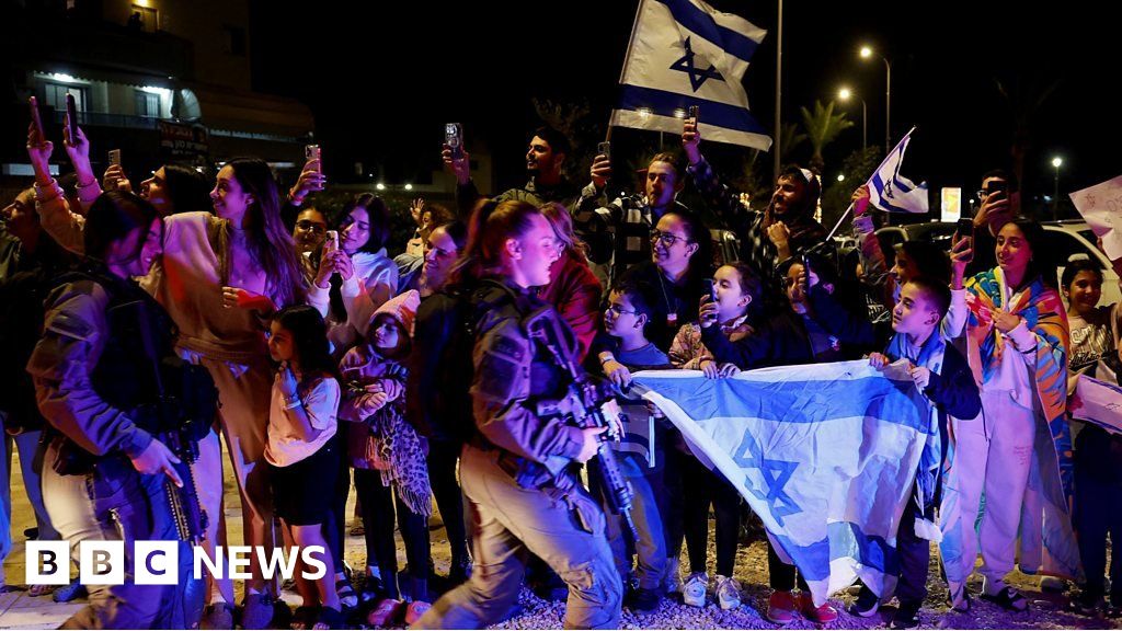 Street celebrations as convoy carrying hostages returns to Israel