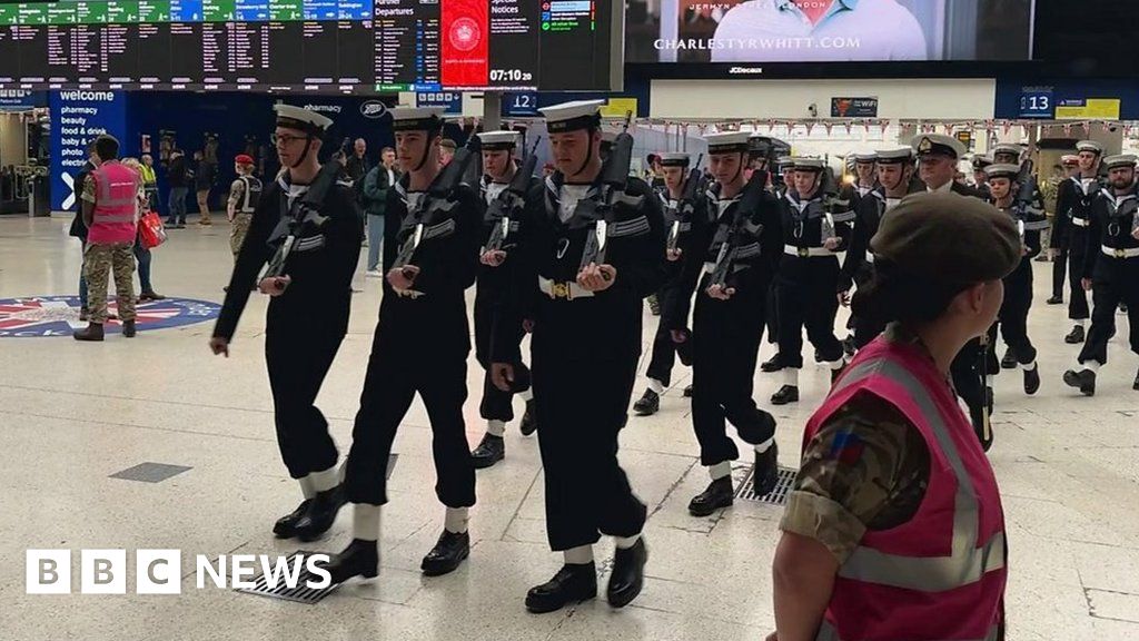 Coronation: Troops arrive at Waterloo station