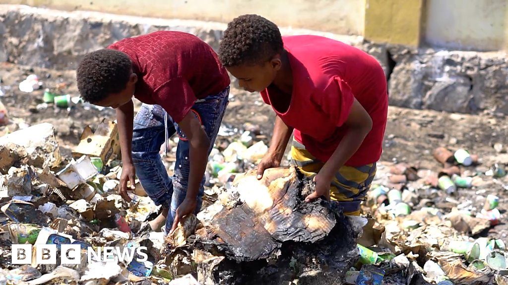 Where do the children play. Picking through the rubbish. To through rubbish. Pick through.