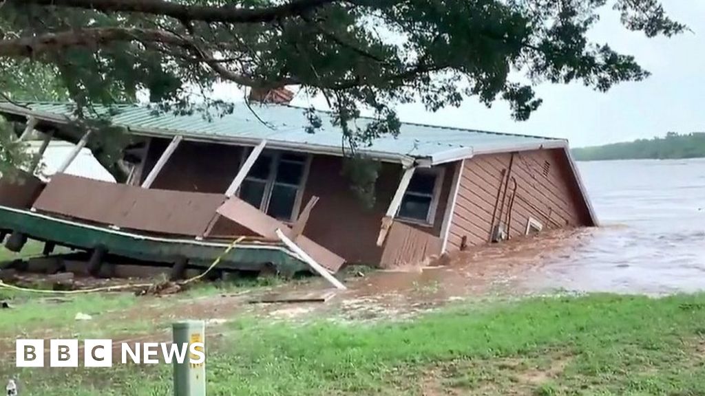 Home swept into river in US
