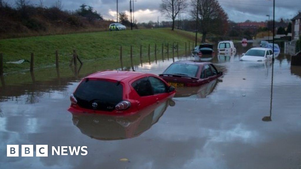 Travel chaos as cars submerged in winter floods - BBC News