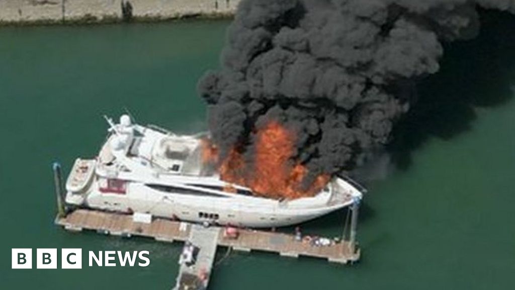Large fire breaks out on superyacht in Torquay harbour - BBC