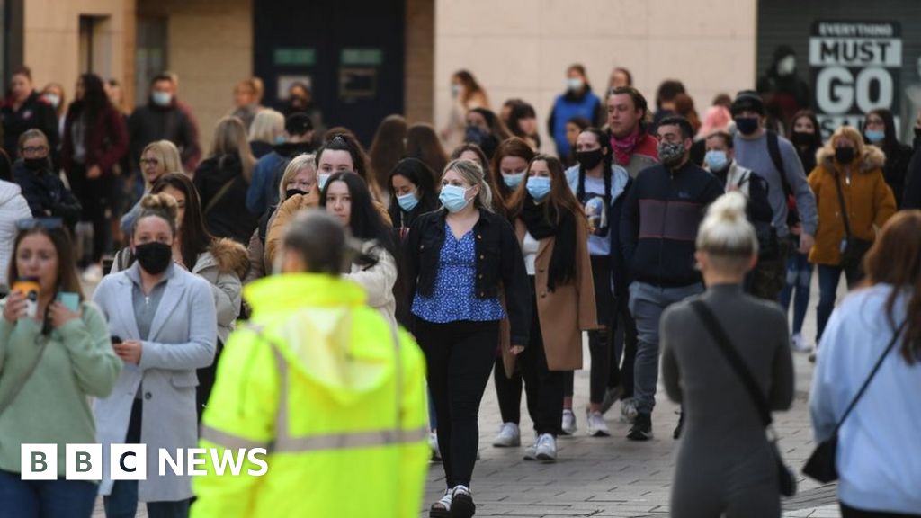 Covid: early queues as wales' shops reopen after lockdown
