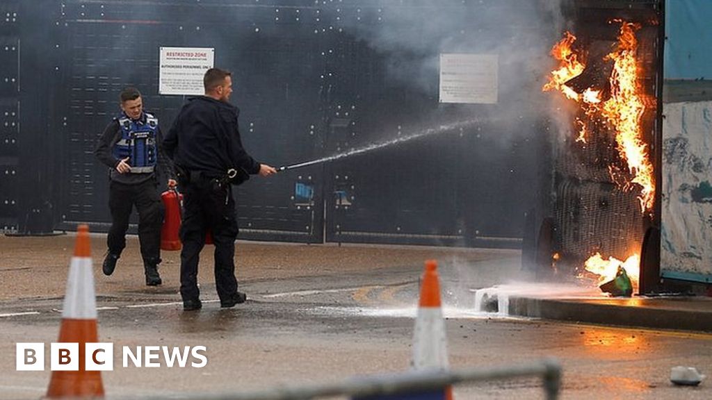 Dover migrant centre: Police search house over fire attack 