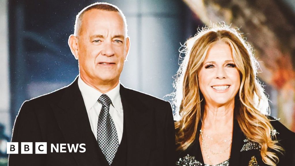Tom Hanks shouts at fans after causing wife to trip