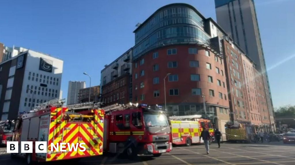 Fire crews rescue 12 people from Birmingham high-rise blaze - BBC News