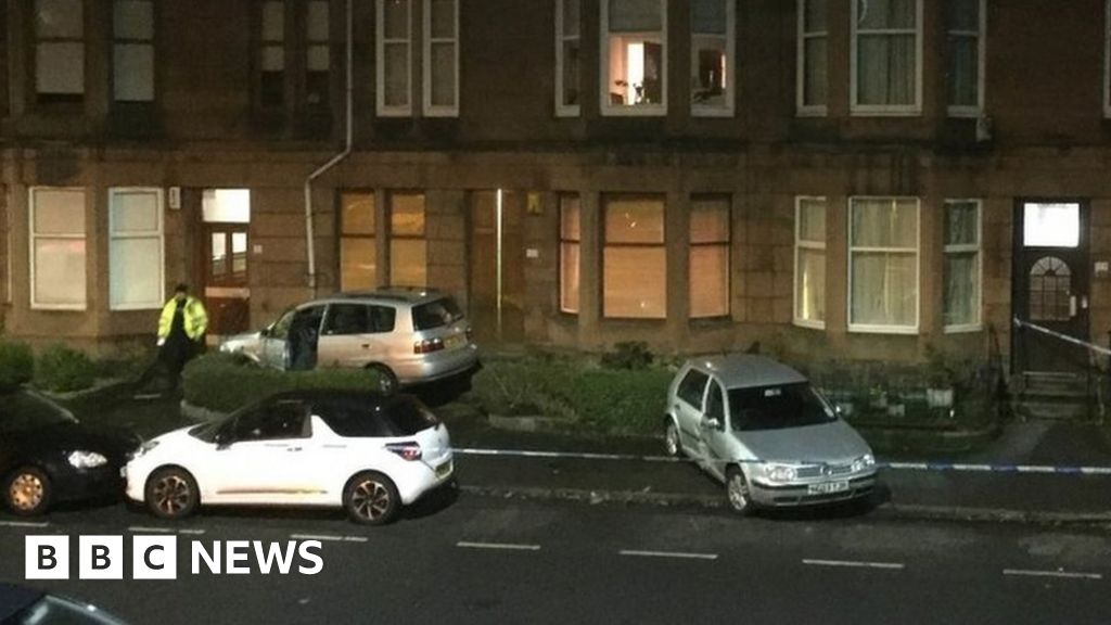 Car crashes into front garden in Glasgow