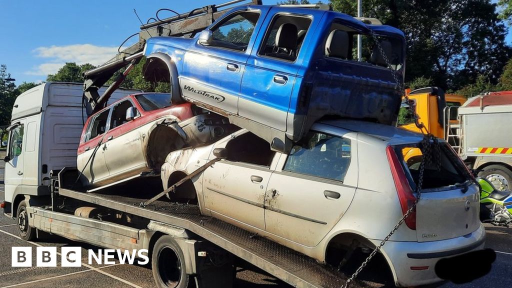 Vehicle carrier stopped by Norfolk Police for insecure load - BBC News