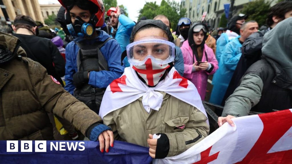 Georgia approves controversial 'foreign agent' law, sparking more protests - BBC News