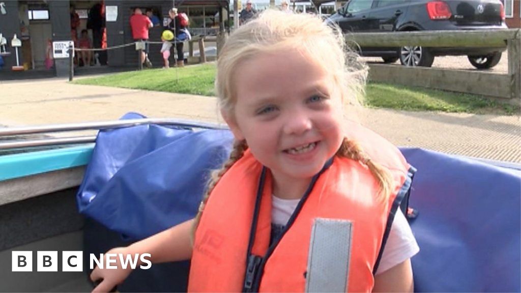 Daisy, six, defies doctors by completing a triathlon BBC News