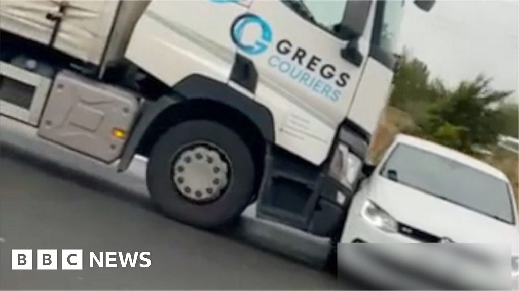 Video posted online shows a passenger in another car on the M1 trying to make the HGV driver aware.