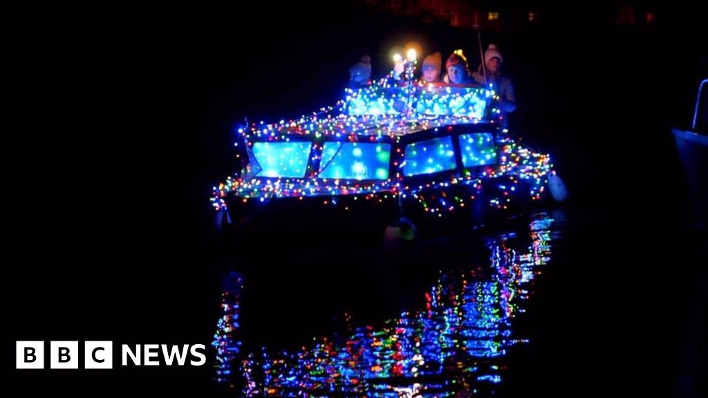Illuminated boats on Grand Union Canal in Milton Keynes