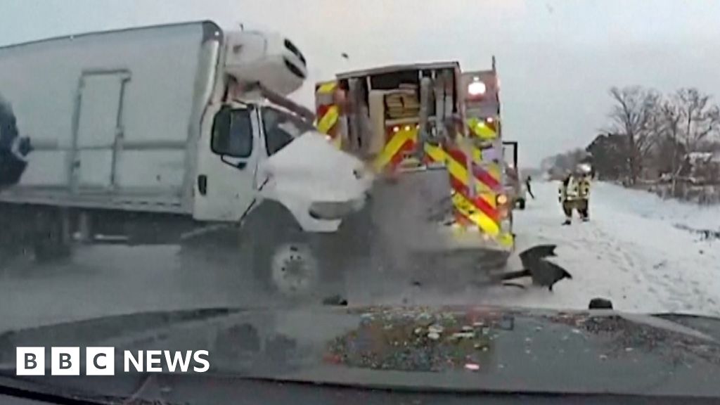 Incredible escape as lorry smashes fire truck on icy US highway