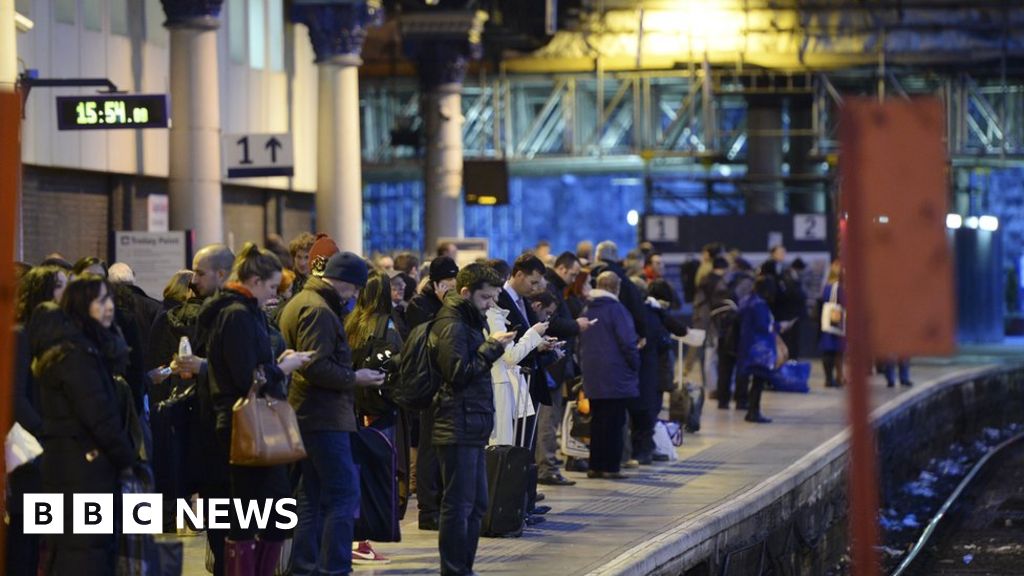 Passengers at Glasgow Queen Street station