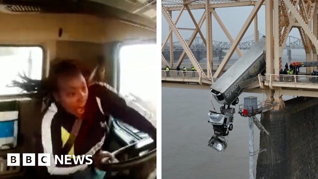 New video shows crash that left truck dangling off bridge – BBC.com