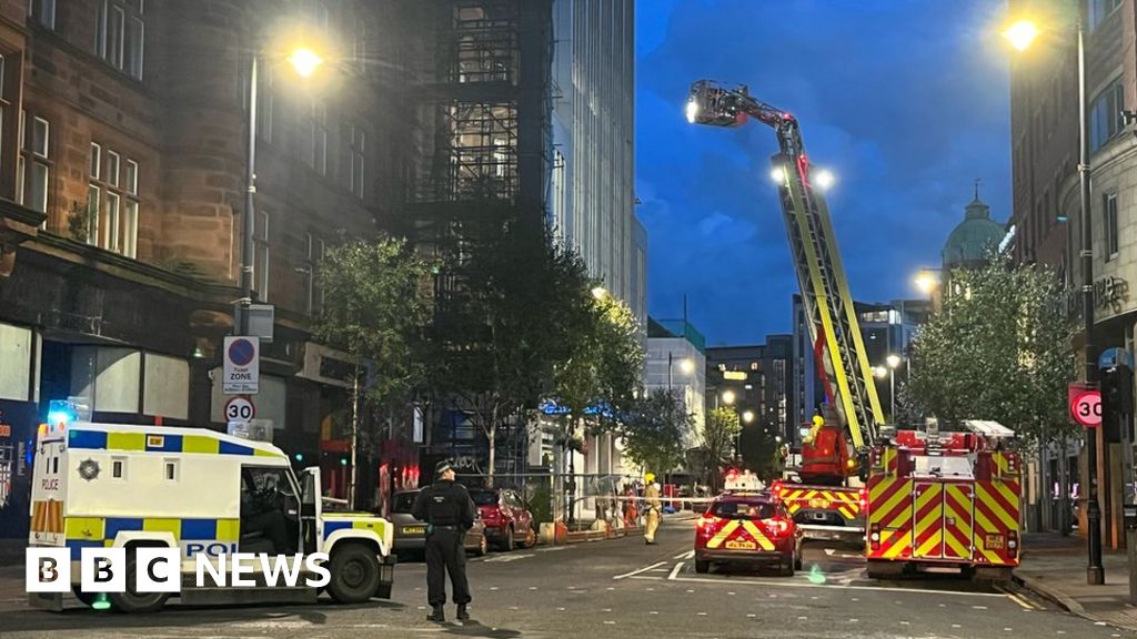 Belfast: Teenagers rescued from George Best hotel building roof - BBC News