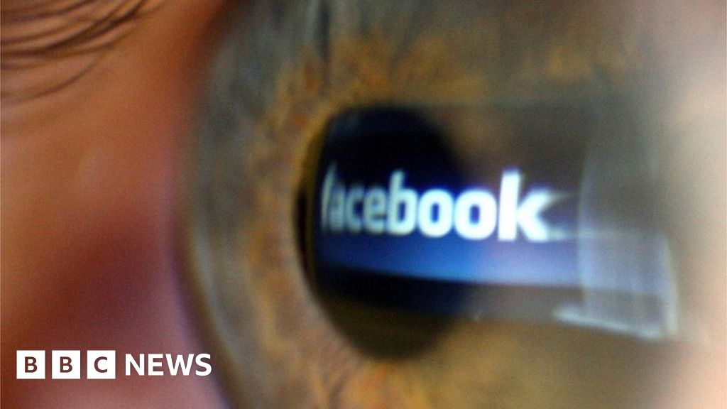 Facebook logo reflected in eye