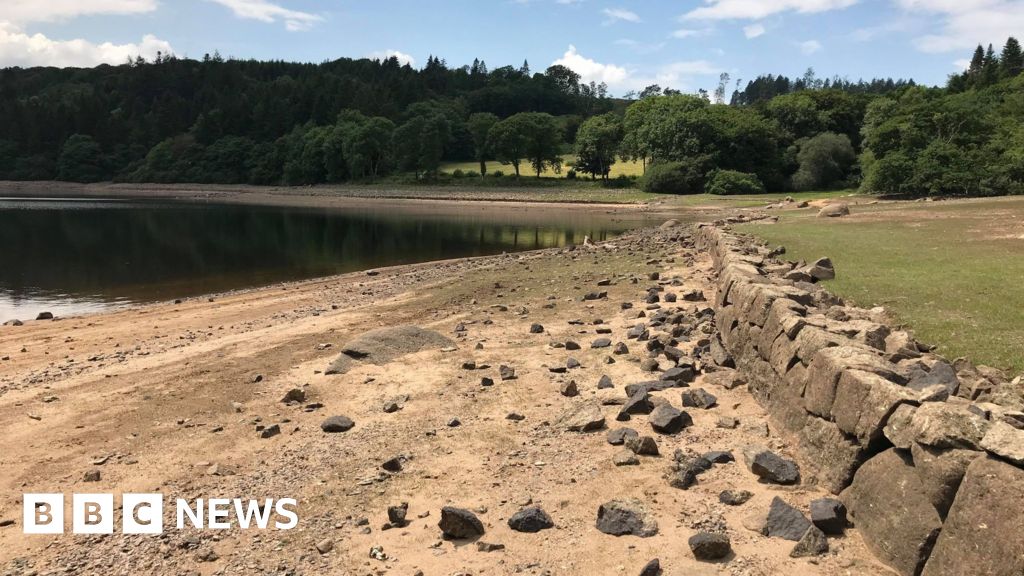 UK heatwave reveals 'drowned village' at Burrator Reservoir 