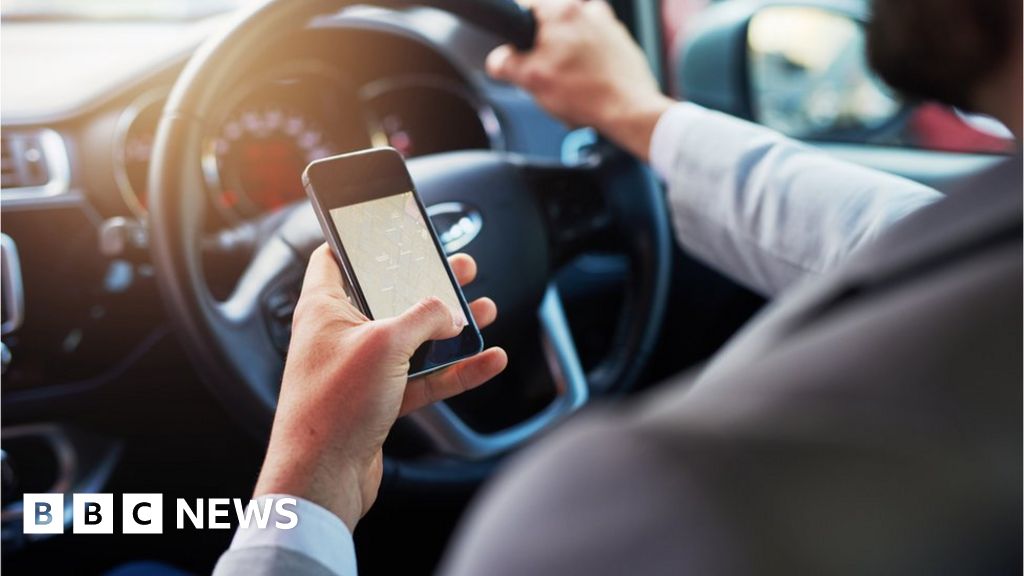 Hundreds of drivers break new phone law - BBC News