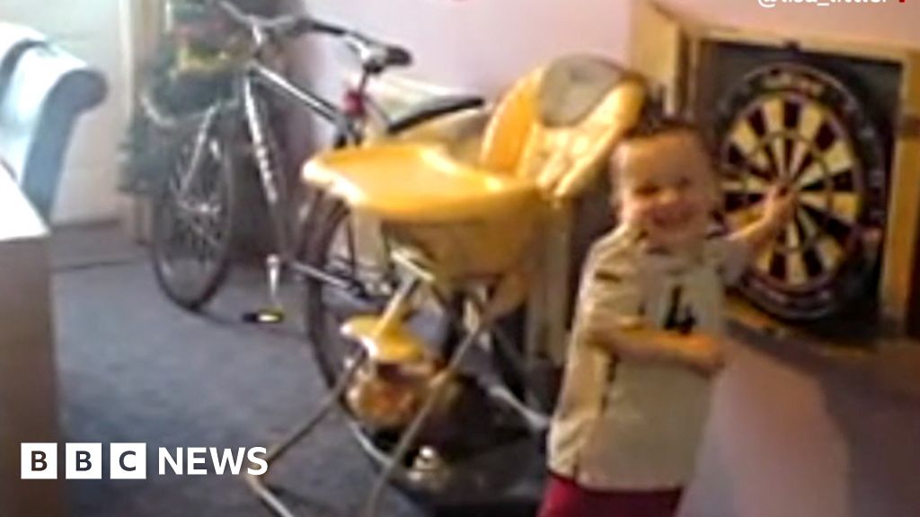 Luke Littler plays darts as a toddler in home video footage - BBC News