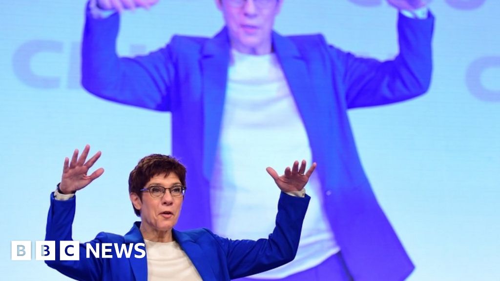 Merkel successor Kramp-Karrenbauer threatens to quit and wins ovation