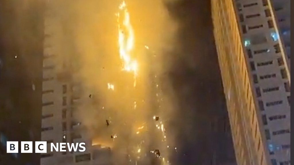 Fire engulfs tower and sprays embers over UAE city