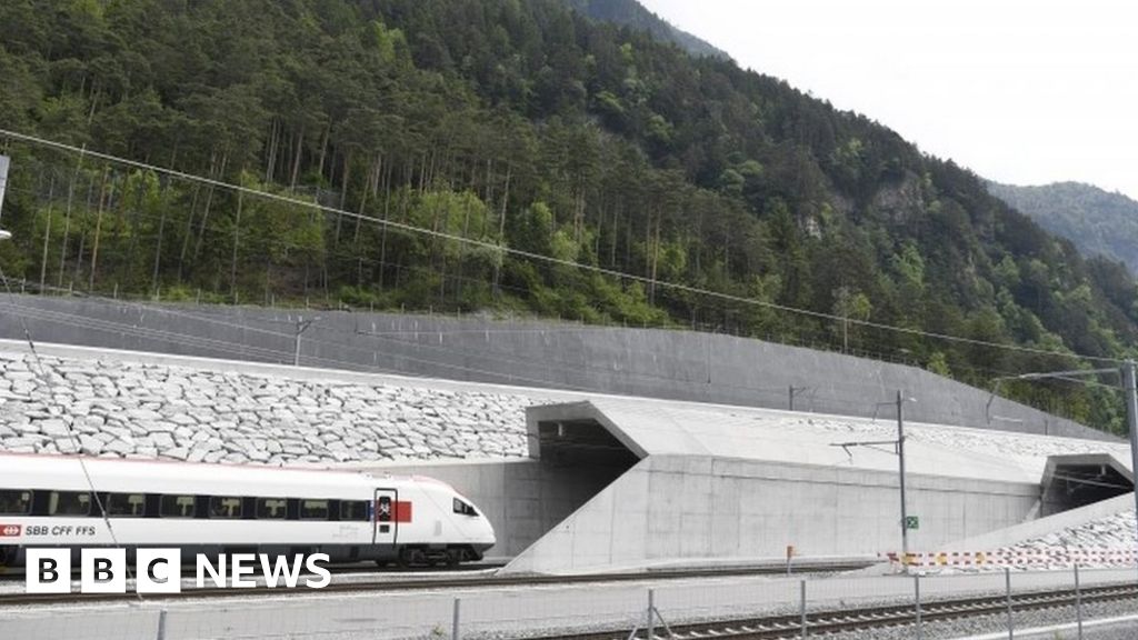 First train enters tunnel near Erstfeld, 1 June