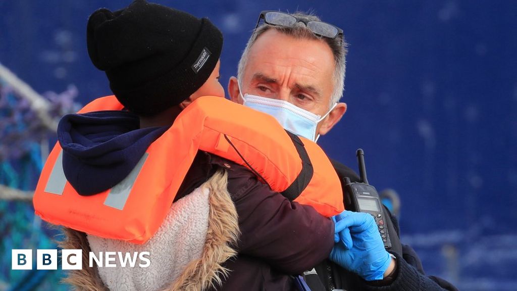 Young child among migrants crossing the English Channel