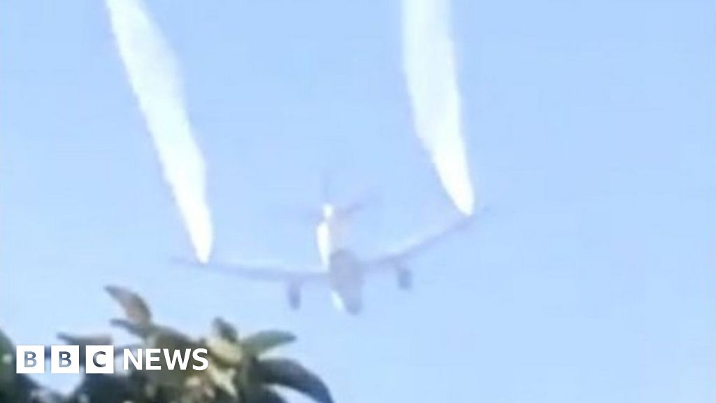 Plane dumps fuel over school in emergency landing
