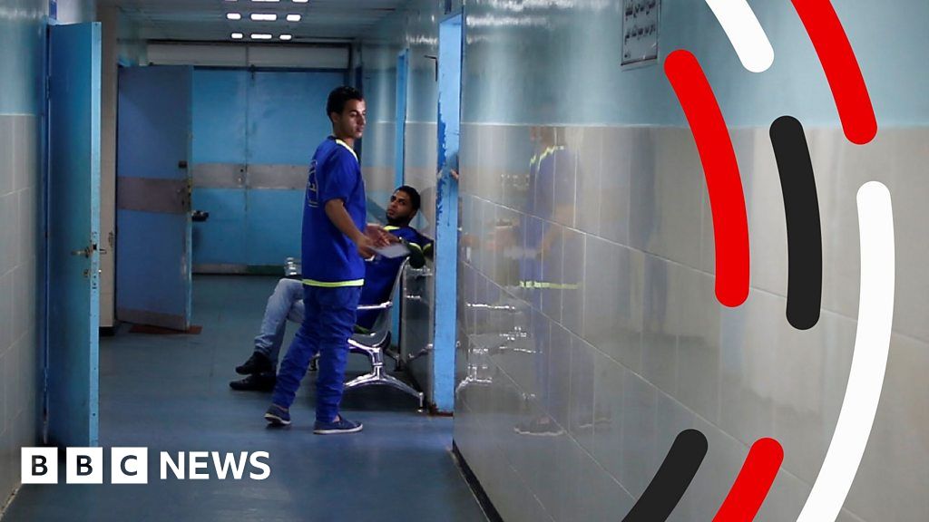 A medical worker in a corridor at Al-Shifa hospital