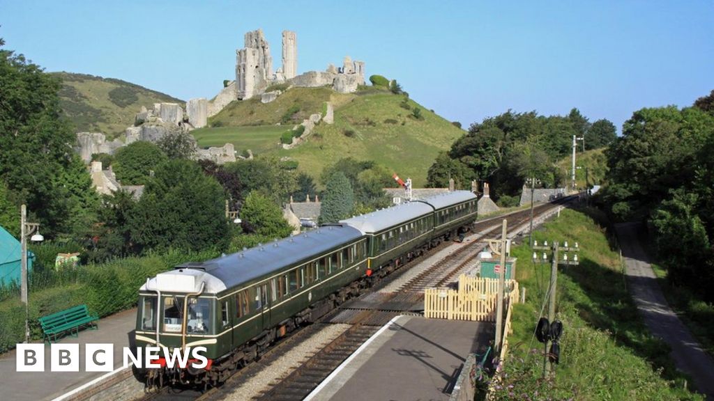 A steam train on the Swanage Railway line at Corfe Castle
