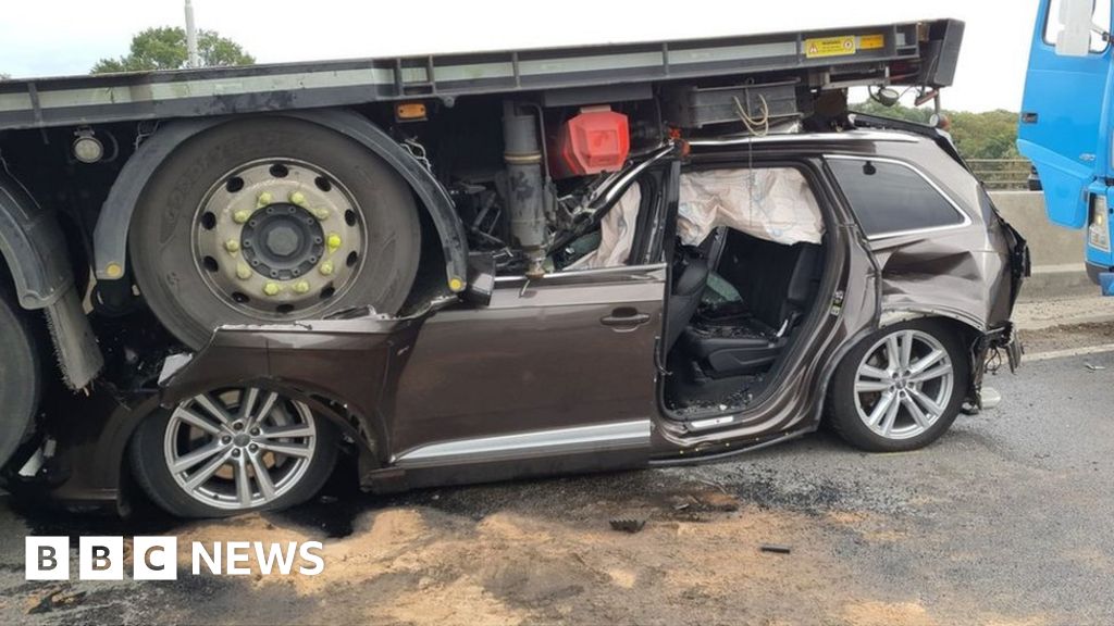 A13 crash Driver seriously hurt as car crushed under lorry BBC News