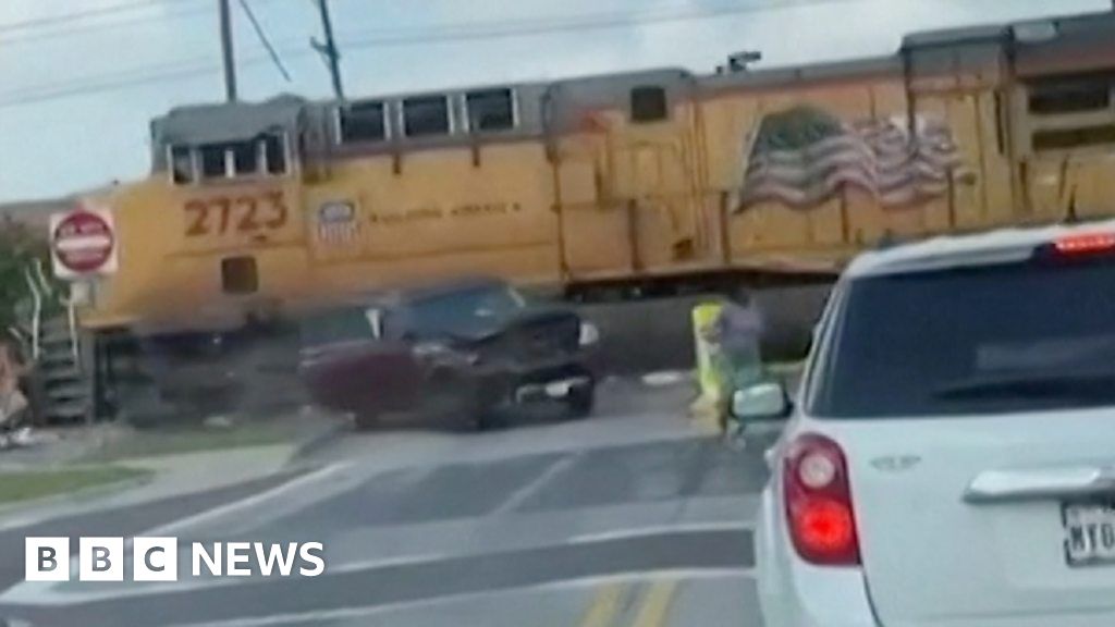 WATCH: People flee car stuck on train track seconds before crash