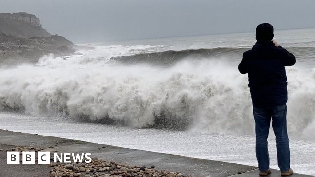 Portland Chesil Beach flooding 'Freak wave' throws rescuer into wall