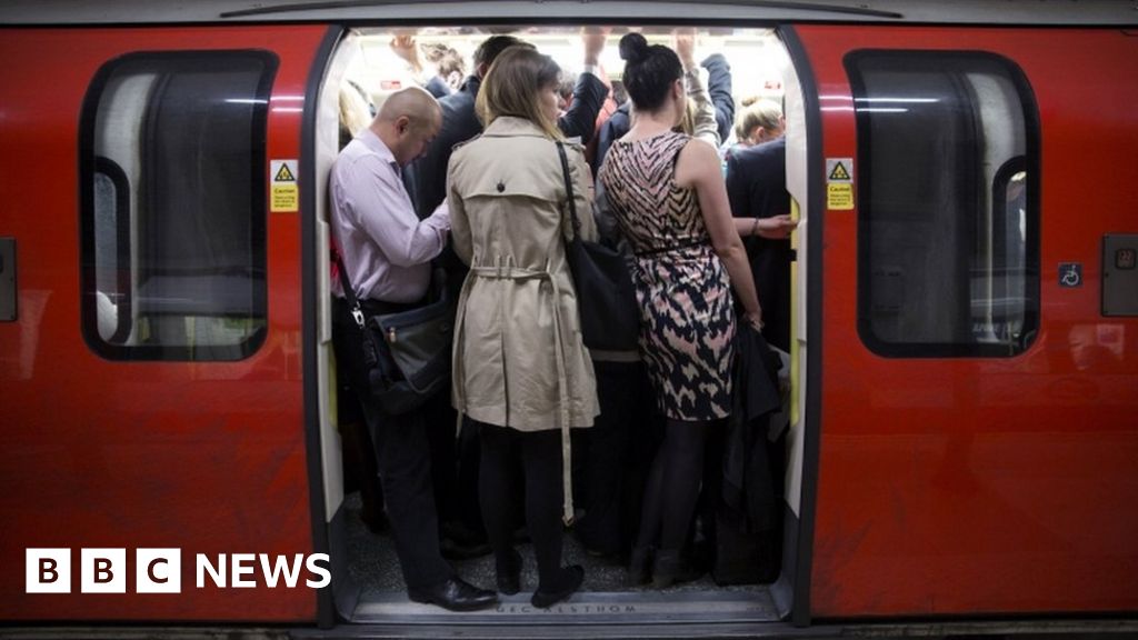 Passengers on a Tube train