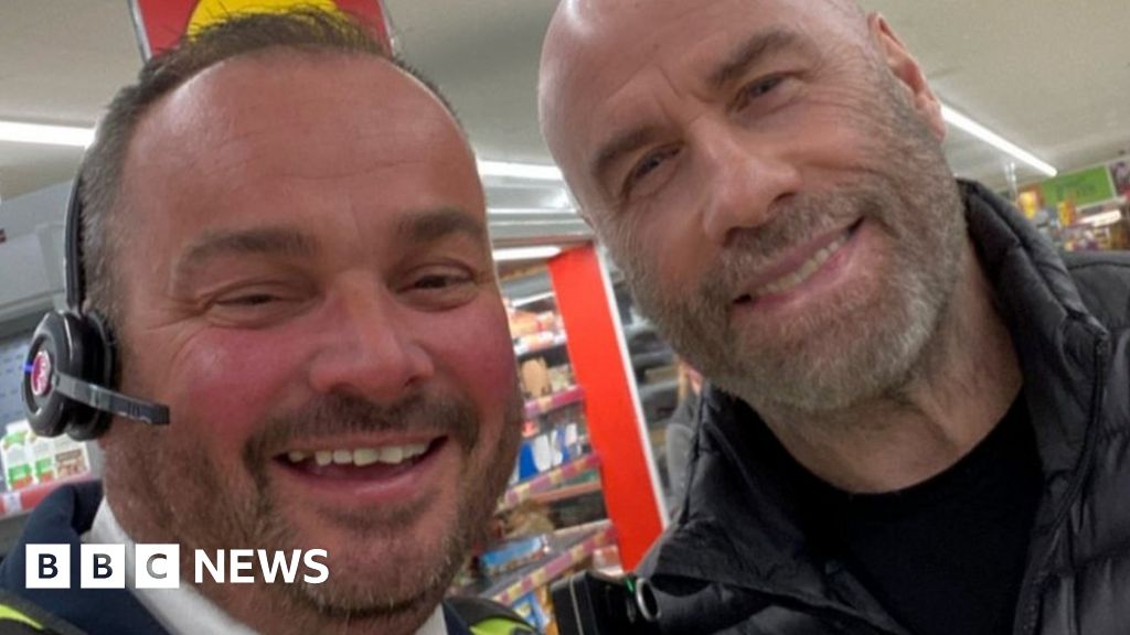 John Travolta poses for photos in Norfolk Morrisons and Wetherspoon
