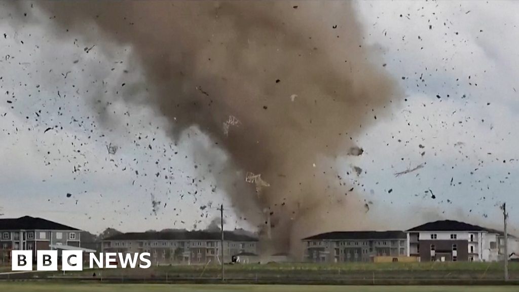 Watch moment tornado sends debris flying in US city