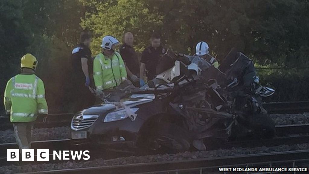 Man charged after train hit car on level crossing near Burton upon