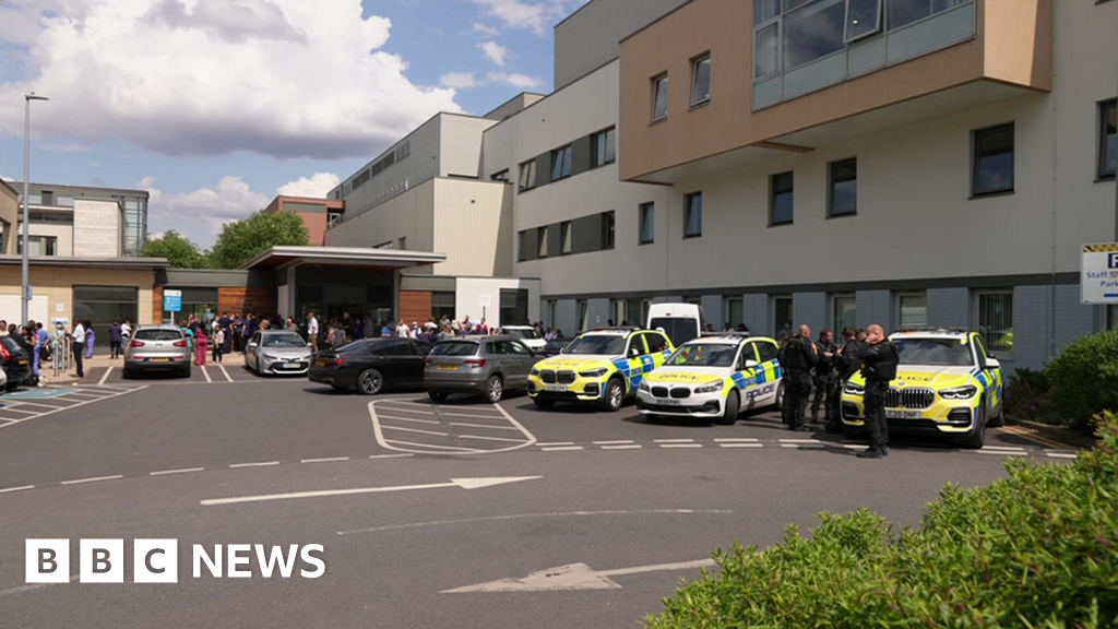 Armed police officers at London hospital after people injured