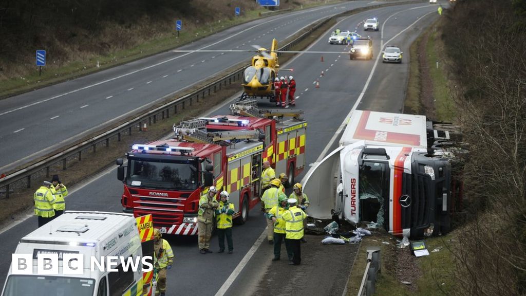 Driver airlifted to hospital after M74 lorry overturns - BBC News