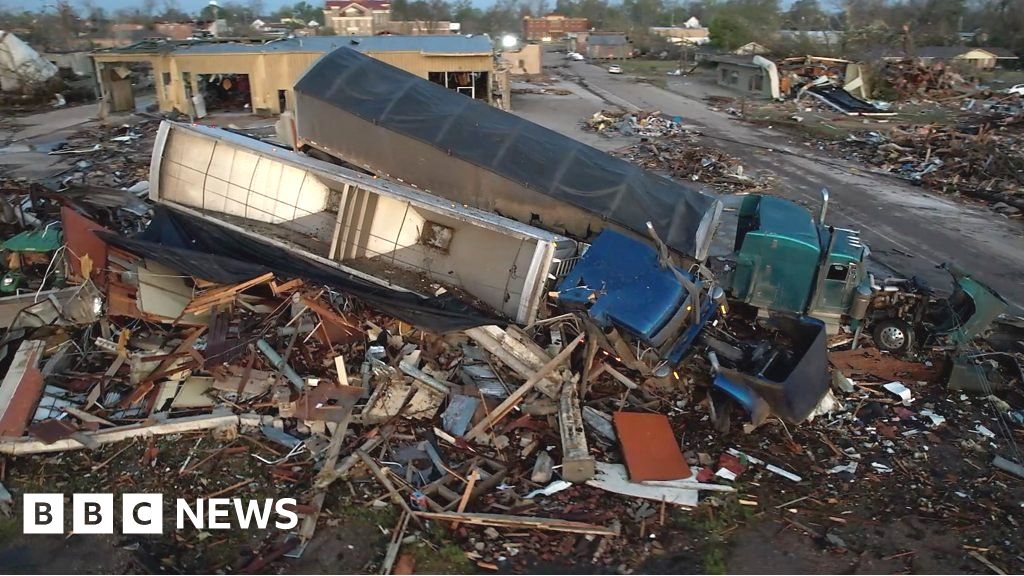 Trucks piled on buildings as tornado hits Mississippi