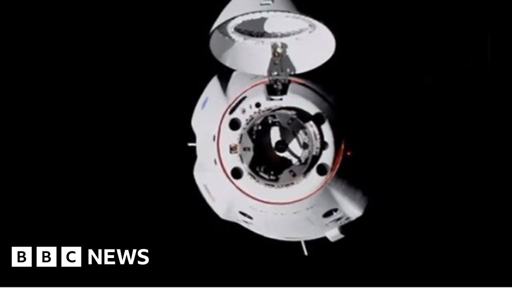 Nasa SpaceX mission: Dragon capsule docks with space station
