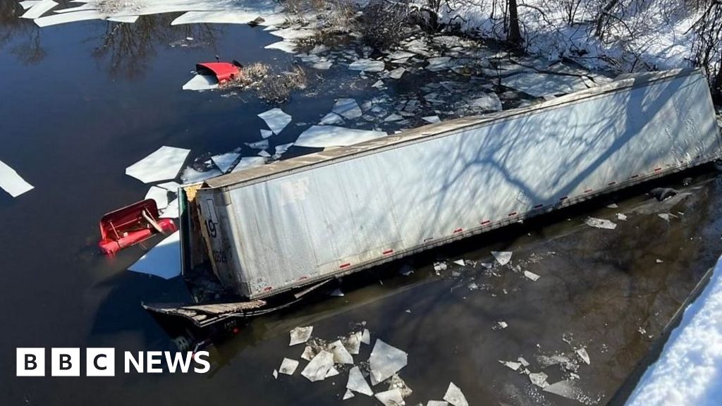 Truck plunges off bridge into icy river in Massachusetts