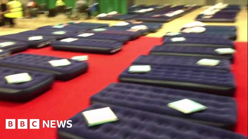 Air beds laid out in Swiss Cottage leisure centre BBC News