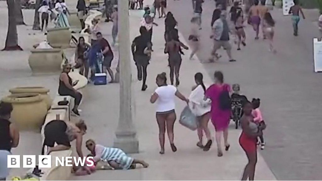 Watch: Beachgoers run for cover as shooting breaks out