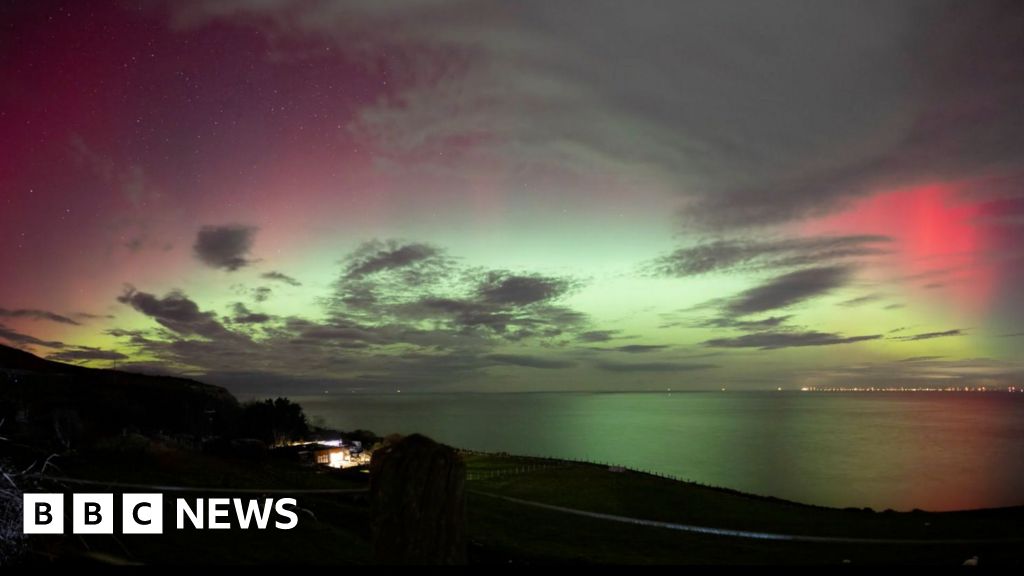 Northern lights turn Wales' skies pink and green