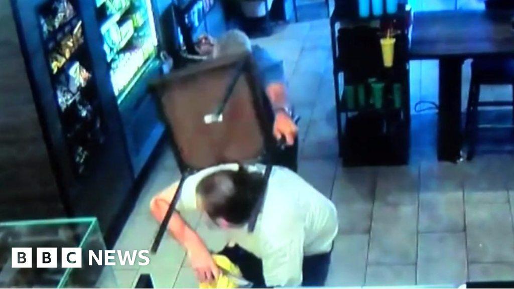 CCTV Shows Starbucks Customer Tackling Armed Robber    97060660 P059kc0y 